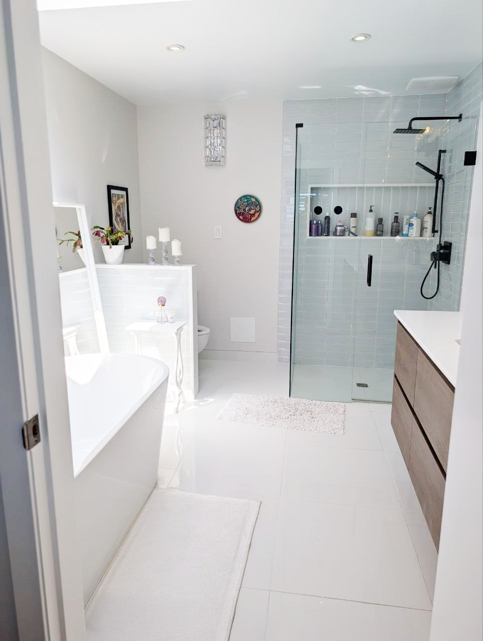 White Rock ensuite — freestanding soaker tub beneath new skylight with ocean view