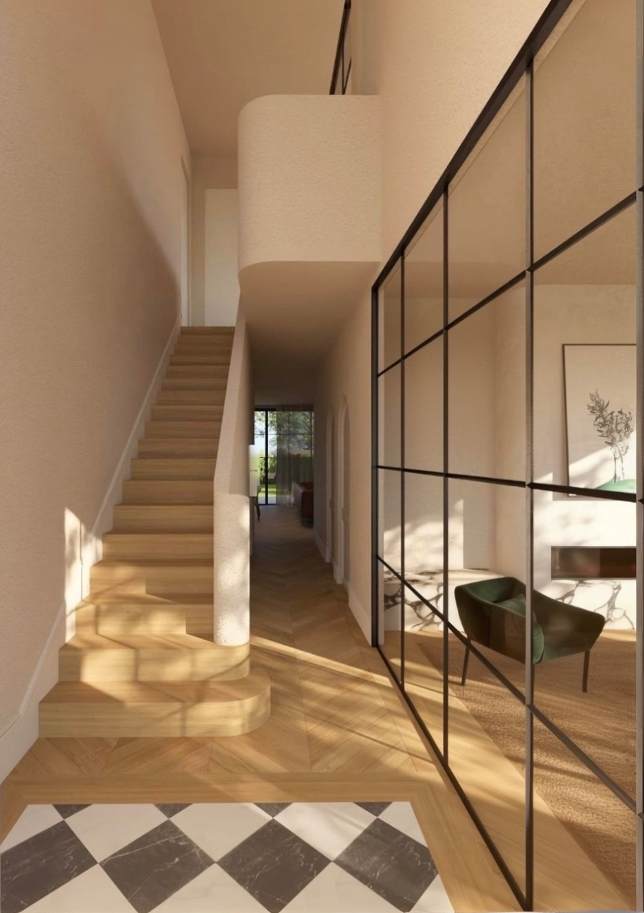 Hart House — interior hallway with curved stair, chevron oak flooring, and black-framed glass partition