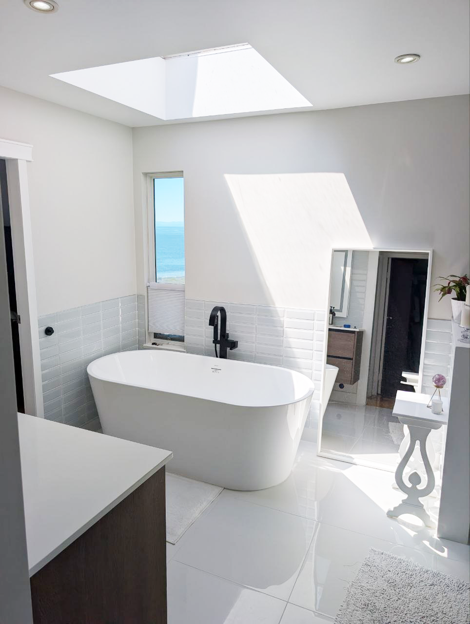 White Rock ensuite — freestanding soaker tub with new skylight and ocean view