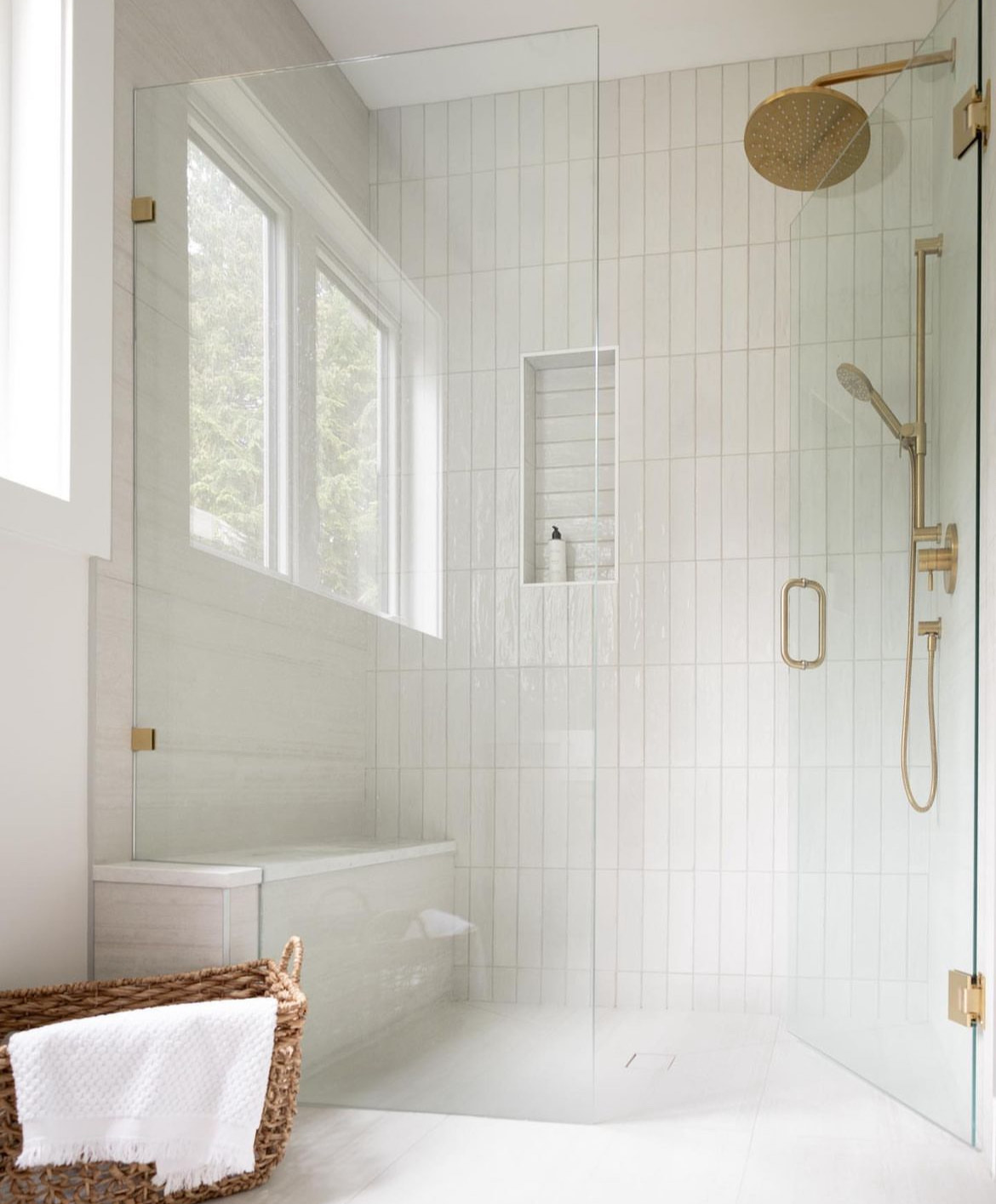 Tsawwassen Residence — walk-in shower with vertical stacked tile, brass fixtures, and bench seat