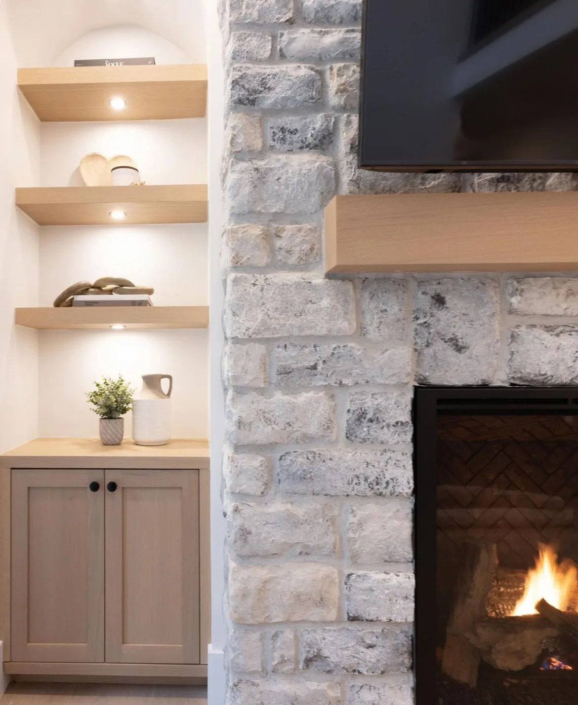 Tsawwassen Residence — stone fireplace with white oak mantel and built-in shelving