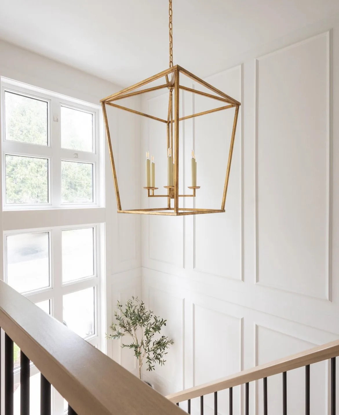 Tsawwassen Residence — stairwell with brass lantern pendant and panelled wainscoting