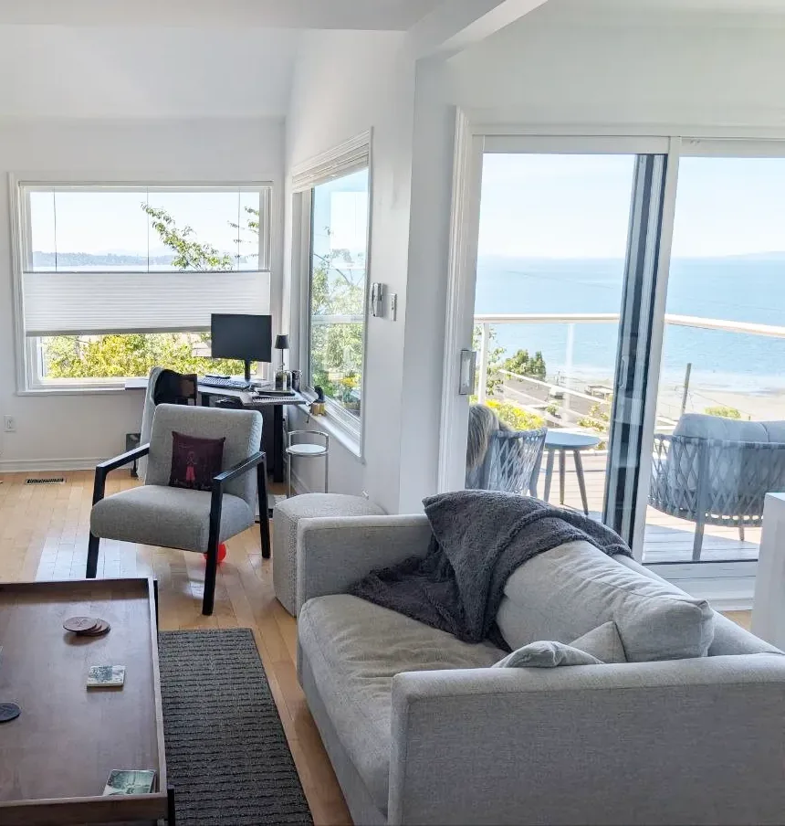 White Rock living room — ocean view through wide windows and sliding doors